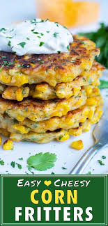 Drop spoonfuls of corn fritter . Crispy Southern Corn Fritters Recipe Evolving Table