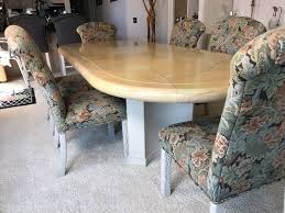 A trio of neutral colors and subtle shapes make up the room décor of this fresh country look. Custom Dining Table With Decoupage Top And Eight Upholstered Dining Chairs 108l X 43w X 29 5h
