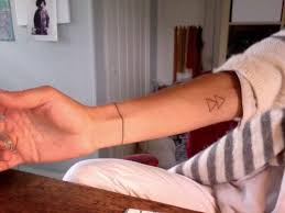 Dwelling upon inner arm tattoos, first of all, it is necessary to tell that softness of the skin in that particular area absolutely does not serve the aim of making the whole and it is up to you, whether to make an inner arm tattoo. Double Triangle Tattoo On The Inner Arm Tattoogrid Net