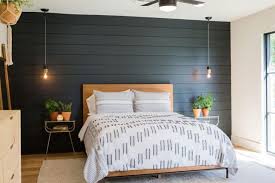 I also love how she tied in the black iron chandelier, this really brings the room accents together. Stunning Black Accent Walls In Bedrooms For A Modern Boho Look