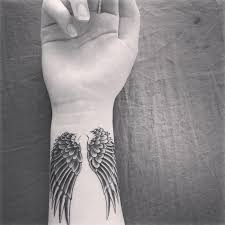 Black And White Angel Wings Tattoo Black And White Photo Wrist Tattoo Angel Tattoos For Men In 2020 Angel Wings Tattoo Wing Tattoos On Wrist Broken Wings Tattoo