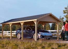 Grey outdoor storage shelter with sidewalls and rolled up doors. Prefab Wooden Garages For Sale Pineca Com