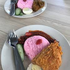Sweet sambal is traditionally served with nasi lemak and also side dishes fried crispy anchovies, toasted peanuts, boiled egg and cucumber.52 Nasi Lemak Sambal Strawberry