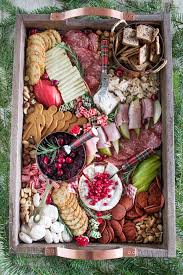 Charcuterie is a french term for a branch of cooking devoted to prepared meat products, such as bacon, ham, sausage, terrines, galantines, ballotines, pâtés, and confit, primarily from pork. How To Make A Christmas Cheese Board Freutcake