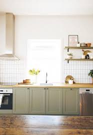 Olive Green Shaker Cabinet Doors Pair Beautifully With White Tiles A Timber Bench Top And Silver New Kitchen Cabinets Kitchen Remodel Wooden Kitchen Cabinets