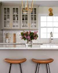 Fabrication & installation of high quality marble countertops for your hom. What A Beautiful And Warm Kitchen I Love The Gray Cabinets The Brass And The Wooden Counter Stool Warm Kitchen Kitchen Design Glass Fronted Kitchen Cabinets