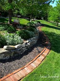If you have a sloping garden, level it off with a retaining wall constructed of stacked bricks. Brilliant Diy Garden Decor Ideas With Old Bricks To Save Your Money The Art In Life Brick Garden Diy Lawn Landscape Edging