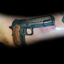 Sailor jerry's lucky 13 motif is probably the most famous set of tattoo designs that flip a bad luck symbol on its head. 50 1911 Tattoo Ideas For Men Handgun Designs