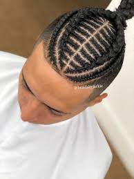 Pin By Oreo D Alvarez On Braids Man Bun Mens Braids Hairstyles Braided Man Bun Hair Styles