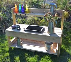 Mud kitchen implements get extra dirty, so include some plastic buckets as a makeshift sink area which can easily be hosed down when playtime is over. Pre School Mud Kitchen Louise Kool Galt