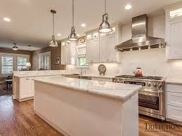 White macaubas quartzite on the kitchen countertop that matches with the white cabinet just underneath it looks lovely. Pure White Quartzite Countertops