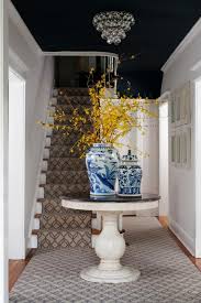 This Gorgeous Entryway Manages To Be Both Formal And Inviting With A Round Pedestal Table Welcoming Guests Entry Table Decor Round Table Decor Foyer Decorating