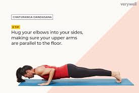 Strengthen your legs by keeping them extended. How To Do Low Plank Chaturanga Dandasana