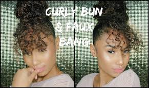 Always ensure that your hair is moist enough to avoid any breakage before you begin making this style as it will add to its overall beauty. Faux Curly Bun Faux Bang Using Drawstring Ponytail Youtube