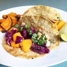 Place some slaw over the tortillas, top with mango salsa and fish cut into smaller pieces. Blackened Fish Tacos With Red Cabbage And Mango Slaw