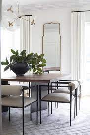 Tall Arched Mirror In The Dining Room White Walls White Curtains Modern Glass Minimalist Dining Room Dining Room Furniture Modern Dining Room Centerpiece