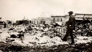 Among the headlines are 'police drag woman behind motor cycles' and '$2500000 of negro property is destroyed'. Greenwood 1921 One Of The Worst Race Massacres In American History 60 Minutes Cbs News