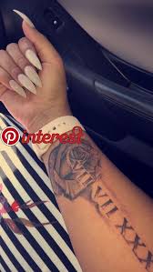 When we talk about the tattoo ideas, the first thing comes to our mind is the floral tattoo. Rose And Roman Number Tattoos On Wrist Tattoos Pinterest Tattoos Tattoo Designs And Flower Tattoos Tattoos Hand Tattoos Small Tribal Tattoos