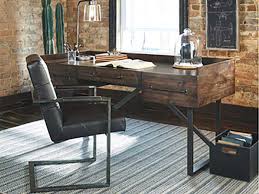 A traditional desk is similar to a table but may also include shelves or drawers for storage. Ashley Furniture Home Store Launches Chic Home Office Desks
