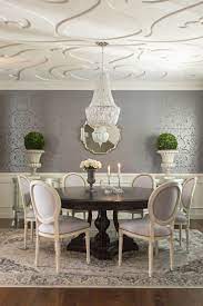 The color palette in blues gives a calm sensation and becomes warmer adding natural texture in the wool rugs and the pendant lamp shade, which, placed centrally. 11 Breathtaking Dining Room Wallpapers