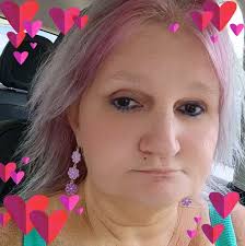 A cat who survived a nearly 400-foot fall has been adopted by the woman who  came to her rescue.