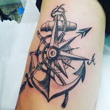 This tattoo differs by replacing the hot air balloon with party balloons and embellishes the shank of the anchor with a ship wheel. Anchor Compass Tattoo Sagitarious Symbol Compass Tattoo Men Tattoos For Women Tattoos For Guys