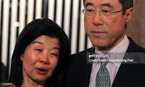 Chief Executive candidate Henry Tang Ying-yen and his wife Lisa Kuo... News  Photo