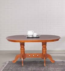 Find the perfect home furnishings at hayneedle, where you can buy online while you explore our room designs and curated looks for tips, ideas & inspiration to help you along the way. Buy Four Seater Oval Dining Table In Matte Teak Finish By Furncoms Online 4 Seater Dining Tables Dining Furniture Pepperfry Product