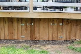 This custom built cedar fence & pergola were a beautiful. Turtles And Tails Under Deck Enclosure With Access Door