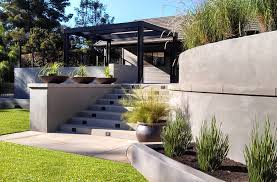 Concrete block retaining wall construction consists of number of phases including excavation, foundation soil preparation, retaining wall base construction, concrete block unit placement. Concrete Retaining Walls And Wood Trellis Contemporary Landscape San Diego By Springfield Design Houzz