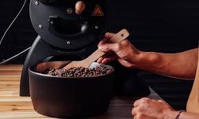 Green coffee beans in air fryer basket