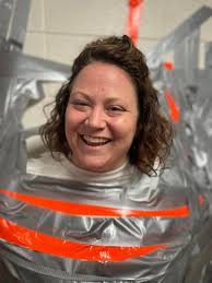 Paris Middle School students tape principal to wall, celebrating test score  growth