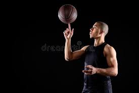 Use your free hand to spin the ball more if it starts to slow down. Young African American Basketball Player Spinning Ball On Finger Stock Image Image Of Athletic Spin 129235863
