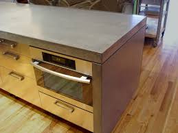 The island cabinets aren't actually attached, so we could move them out of the way when we installed the countertop along the walls. Waterfall Style Concrete Tops