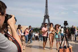 Female artist Milo Moiré is arrested after posing for naked selfies with  tourists beside the Eiffel Tower 