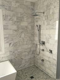 Glass walls on two sides of the corner shower make the bathroom feel larger and welcome light from a nearby window. 6x12 Bianco Carrara Marble Shower Polished Finish Floor Tile Design Tile Floor Tile Design