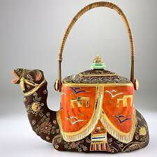This camel is textured gold plated with an ivory or bone colored mantle or saddle that is. Teapots Camel Teapot