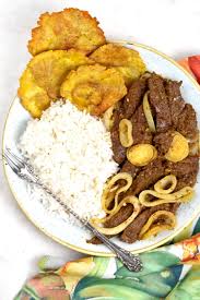 Add the remaining marinade from the bag, the onions, and the remaining garlic. Bistec Encebollado Steak Onions Gypsyplate