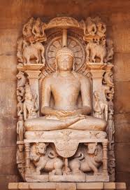 The Jain's statue on a throne in an environment of elephants ...