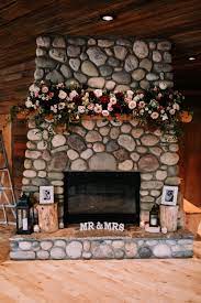 Deep Burgundy Champagne And Pink Flowers For A Stunning Wedding Mantel At Cornerstone Th Wedding Fireplace White Wedding Flowers Wedding Fireplace Decorations