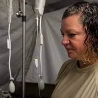 U.S. Navy Lt. j.g. Marius Agbam, a nurse, speaks to