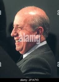 Cleveland Browns owner Al Lerner, left, announces the Browns' adoption of  two families of New York heroes killed