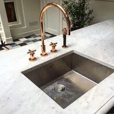 Rose gold and copper are very similar in color so you could also call it marble and copper decor as well. Marble Rose Gold Kitchen Novocom Top
