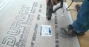 Laying a cement board under a tile. How To Install Backer Board Durock For Floor Tile Tile Floor Cement Board Flooring