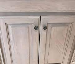 Begin by cleaning near the handles, since this gets the most use and grime is often left behind by our hands. Pickled Cabinetry Refinishing