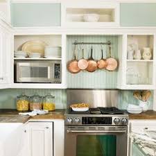 Simple white beadboard backsplash contrasts with a black countertop. 40 Best Beadboard Backsplash Ideas Beadboard Backsplash Beadboard Kitchen Remodel