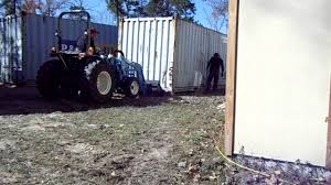 How to move a shipping container with a tractor. The Little Tractor That Can Vs The 5500 Pound Shipping Container Tractorbynet