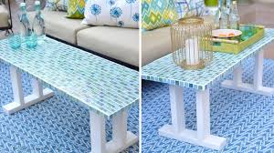 The heavy appearance of a stained timber coffee table can be muted by the simple technique of mosaic tiling. Pretty Mosaic Decor Projects