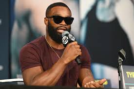 Tyron woodley's mother got in a heated confrontation with jake paul's crew at a press conference ahead of their boxing match. Yxkou Kzqpbqm