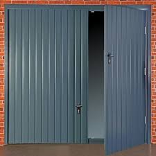Keeping your garage warmer for longer, the bottom slat of a roller garage door has a rubber seal that prevents drafts and your installer: Fort Vertical Rib Steel Up Over Wicket Door